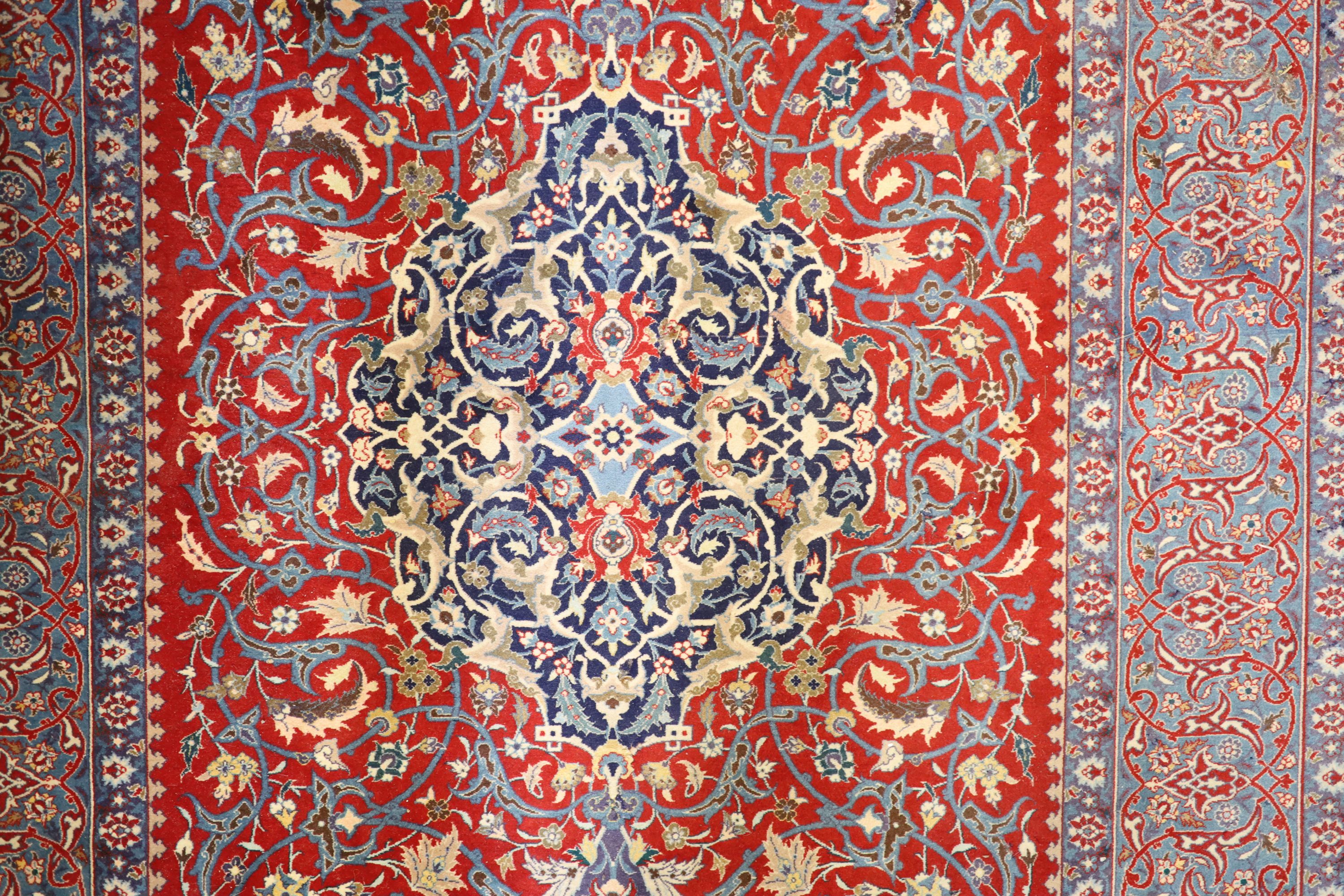 An Isfahan red ground rug, 169 x 110cm